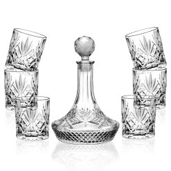 Indulge in the luxury of the Dublin Decanter Set, a stunning collection of high-quality glass glassware designed to elevate your home bar experience. The set features a sophisticated decanter and six matching tumblers, each adorned with intricate diamond-cut patterns that catch the light and create a mesmerizing effect.